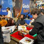 Giochi Uniti al Lucca Comics & Games 2024: la società partenopea finalista al premio Chiosso con “Sipario” e in lizza per il Community Awards con “Botanicus”